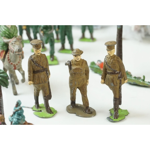 19 - Collection of mid-20th Century figures and soldiers, to include Britains, various regiments, militar... 