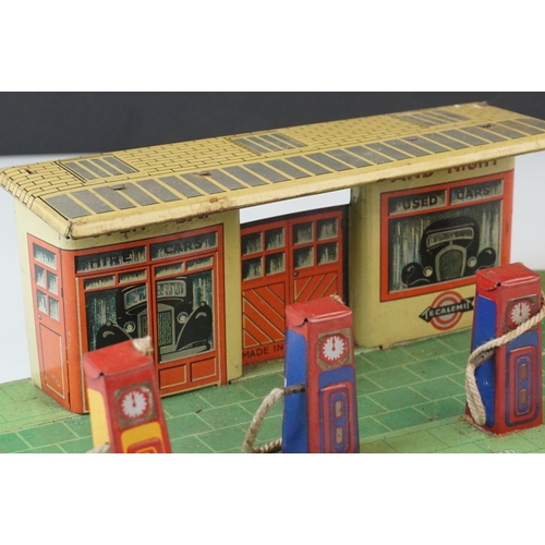 21 - Mid 20th C tin plate garage with petrol pumps, made in England, with Tecalemit logo to front of buil... 