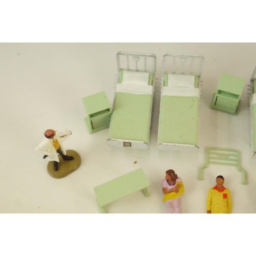 35 - Quantity of loose Britains Hospital figures and accessories, plus 4 x Ensign Limited coloured lanter... 