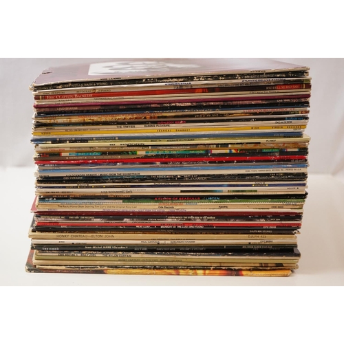 34 - Vinyl - Rock & Pop collection of over 60 LP's to include Eric Clapton, 10cc, The Doors, Jefferson Ai... 