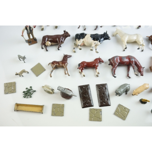 61 - Quantity of mid 20th C metal farm figures, animals and accessories to include Britains, Hornby etc