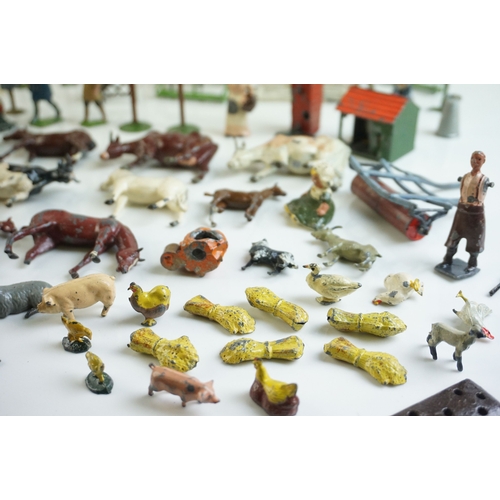 61 - Quantity of mid 20th C metal farm figures, animals and accessories to include Britains, Hornby etc