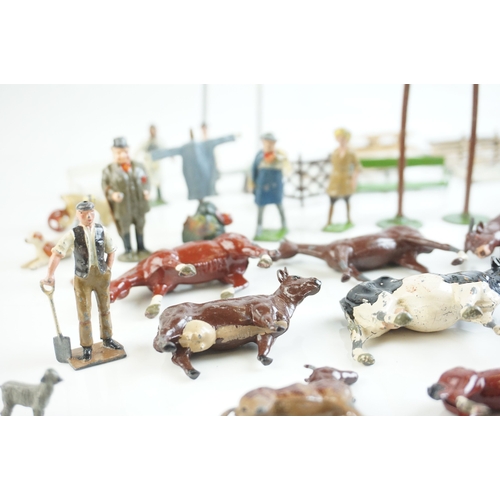 61 - Quantity of mid 20th C metal farm figures, animals and accessories to include Britains, Hornby etc