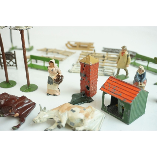 61 - Quantity of mid 20th C metal farm figures, animals and accessories to include Britains, Hornby etc