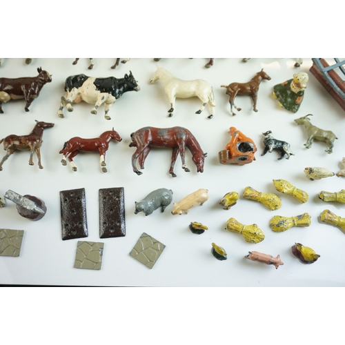 61 - Quantity of mid 20th C metal farm figures, animals and accessories to include Britains, Hornby etc