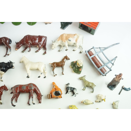 61 - Quantity of mid 20th C metal farm figures, animals and accessories to include Britains, Hornby etc