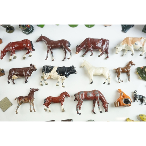 61 - Quantity of mid 20th C metal farm figures, animals and accessories to include Britains, Hornby etc