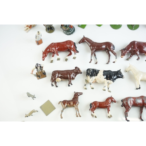 61 - Quantity of mid 20th C metal farm figures, animals and accessories to include Britains, Hornby etc