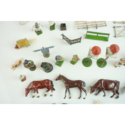 61 - Quantity of mid 20th C metal farm figures, animals and accessories to include Britains, Hornby etc