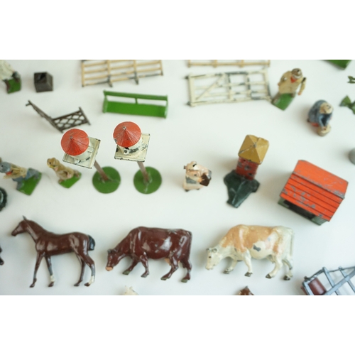 61 - Quantity of mid 20th C metal farm figures, animals and accessories to include Britains, Hornby etc