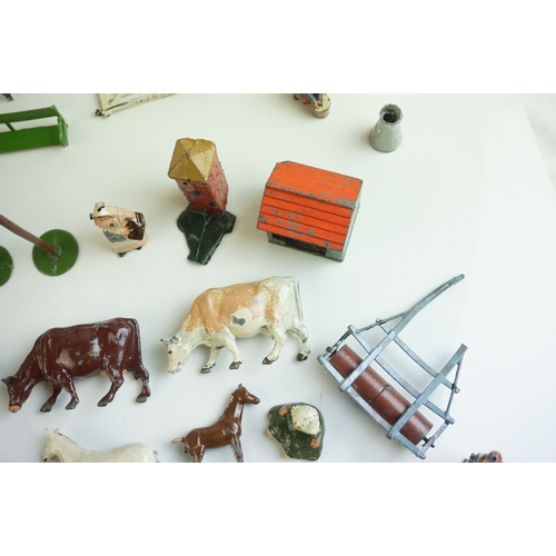 61 - Quantity of mid 20th C metal farm figures, animals and accessories to include Britains, Hornby etc