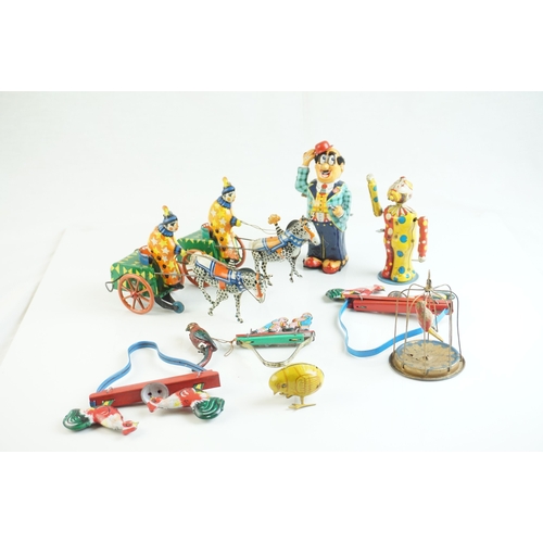 69 - Eight mid 20th C tin plate toys to include French Cachet de Garantie, 2 x Pecking Chickens (China), ... 