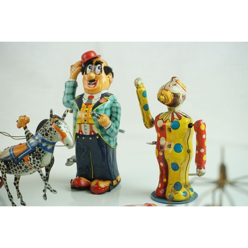 69 - Eight mid 20th C tin plate toys to include French Cachet de Garantie, 2 x Pecking Chickens (China), ... 