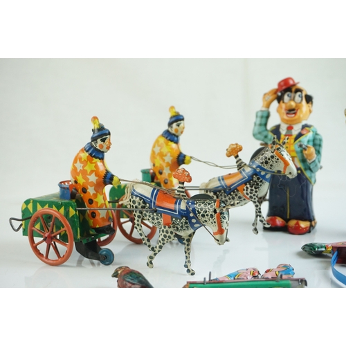 69 - Eight mid 20th C tin plate toys to include French Cachet de Garantie, 2 x Pecking Chickens (China), ... 