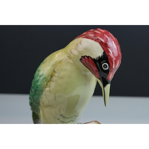 1 - A Beswick Green Woodpecker figure impressed number 1219 green paper label together with a  Royal Sta... 