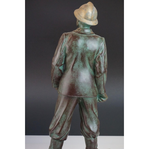 102 - Patinated Metal Model of a Fireman on a Marble base, 44cms high