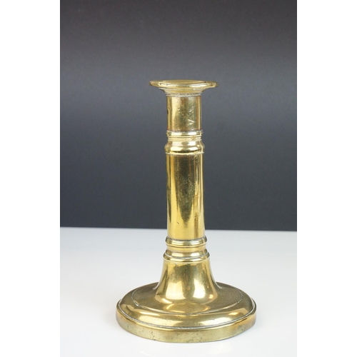 104 - A brass chamber stick and a Telescopic brass candlestick.