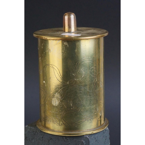 110 - a brass trench art lidded pot with etched decoration made from a 1917 shell case.