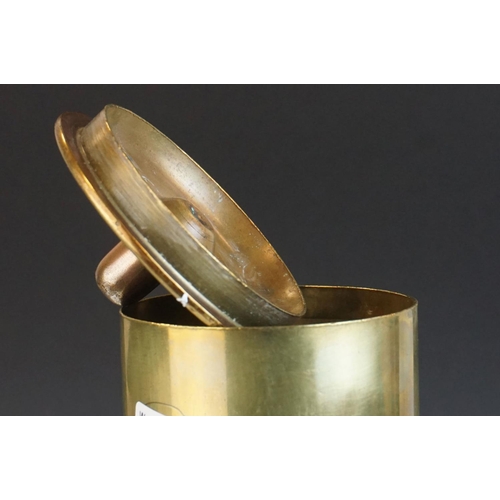 110 - a brass trench art lidded pot with etched decoration made from a 1917 shell case.