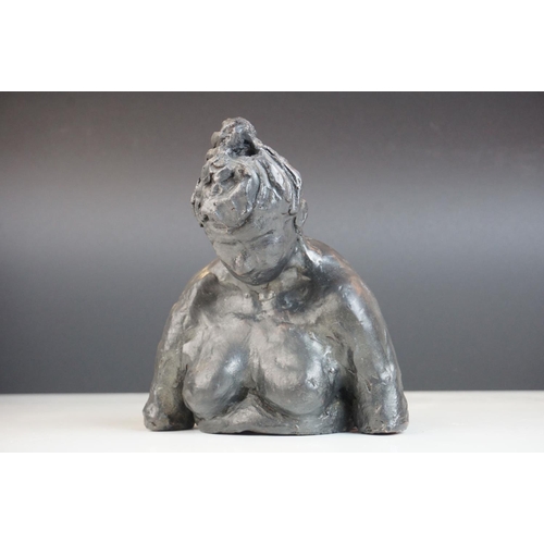 120 - A pottery sculpture of a stylized women.