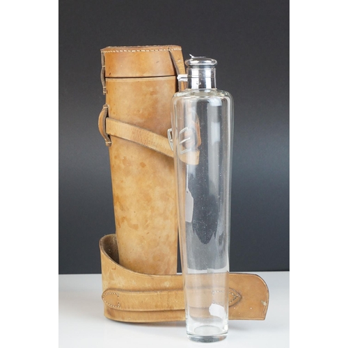133 - A vintage leather saddle flask holder with silverplated and glass flask by James Dixon and Sons