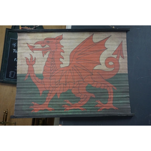 146 - Canvas Hanging Banner of Welsh Dragon Flag, supported on wooden poles, 95cms x 70cms