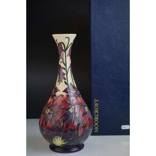 155 - Moorcroft Bottle Neck Vase with tubed lined floral pattern, impressed marks to base and dated 2000, ... 