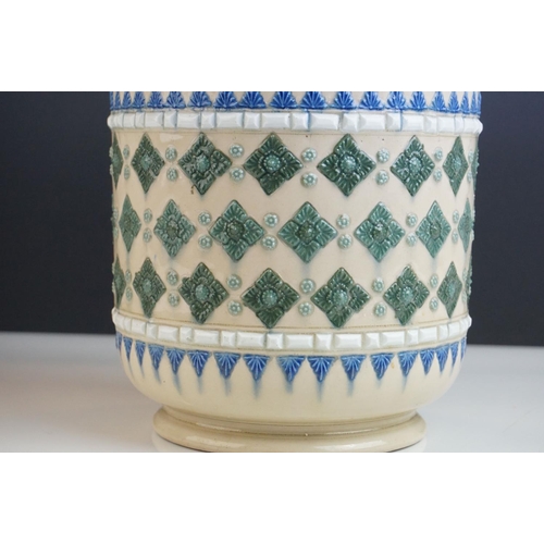 17 - Doulton Lambeth Stoneware Jardiniere / Planter, decorated in relief with blue and green motifs on a ... 