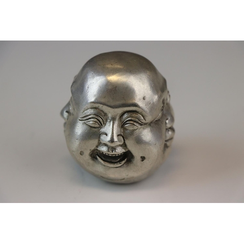 170 - A white metal paperweight in the form of a four faced Buddha signed with character marks.