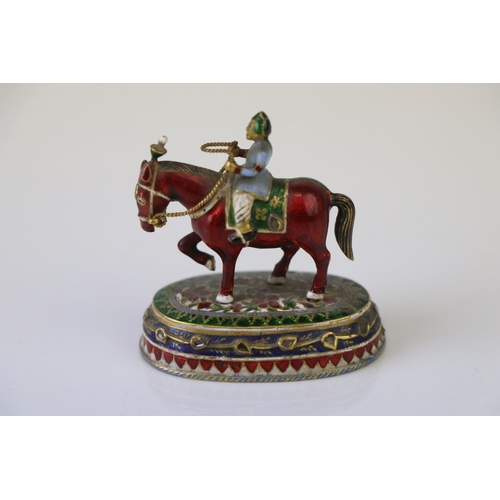 182 - A miniature figure on horseback ornament with cloisonne decoration.