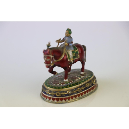 182 - A miniature figure on horseback ornament with cloisonne decoration.