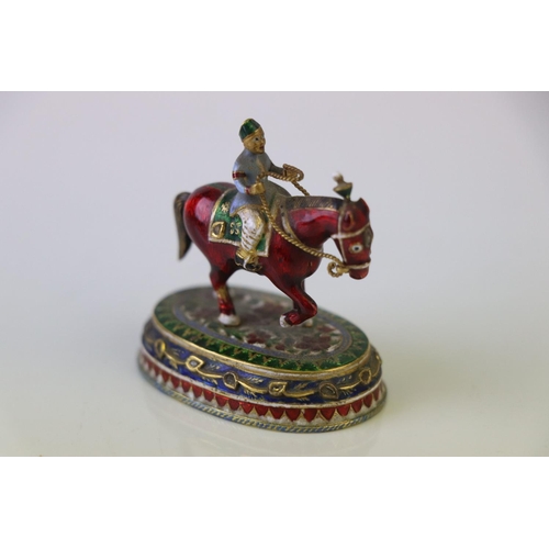 182 - A miniature figure on horseback ornament with cloisonne decoration.