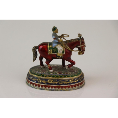 182 - A miniature figure on horseback ornament with cloisonne decoration.