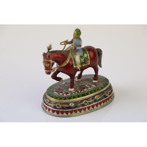 182 - A miniature figure on horseback ornament with cloisonne decoration.