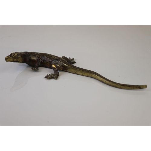 183 - A bronze/brass lizard figure.