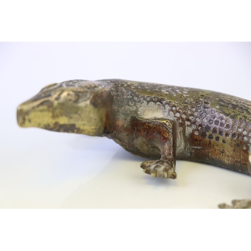 183 - A bronze/brass lizard figure.