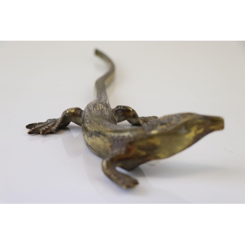 183 - A bronze/brass lizard figure.