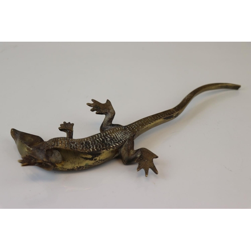 183 - A bronze/brass lizard figure.