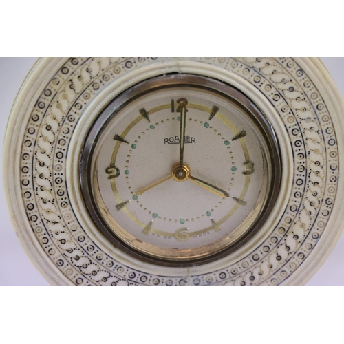 184 - A desk clock with Roamer movement mounted within ivory stand.