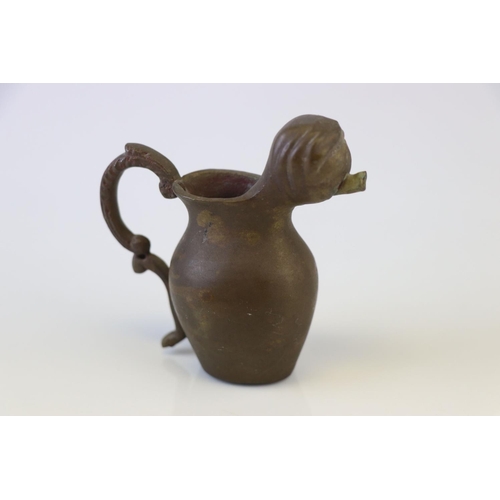 192 - A small bronze miniature drinking vessel.