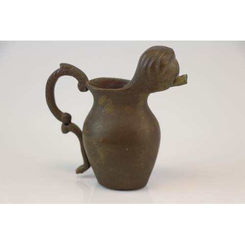 192 - A small bronze miniature drinking vessel.