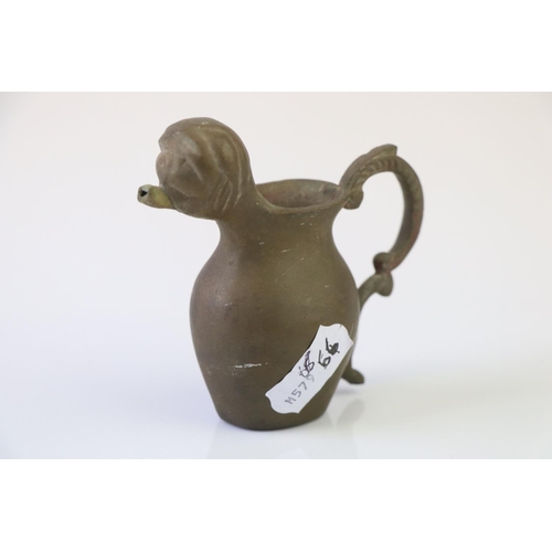 192 - A small bronze miniature drinking vessel.