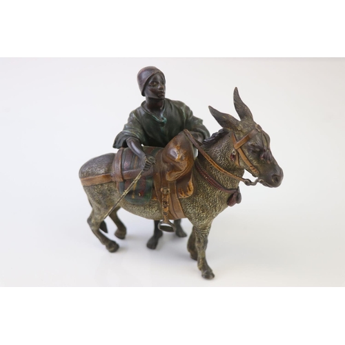 205 - Franz Bergman cold painted bronze of a middle eastern figure with donkey, signed to saddle and numbe... 