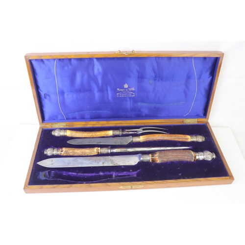 214 - A cased Mappin & Webb carving set with antler handles and hallmarked silver mounts together with a s... 