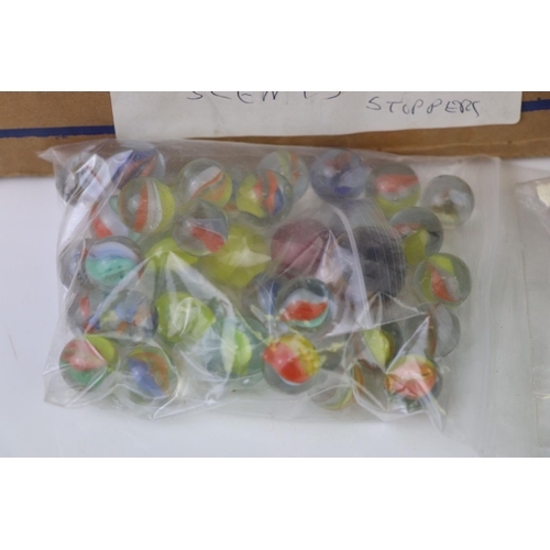 215 - A box of mixed collectables to include scent bottles, marbles and slides.