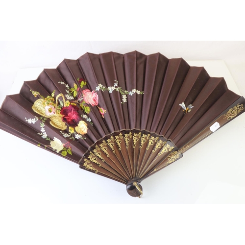 230 - Floral Embroidered Fan with wooden gilt heightened guards, 33cms high, contained in a retail box mar... 