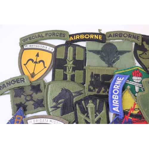 231 - A Collection Of Over 30 Military Cloth Badges, Mainly American and to include Special Forces And Air... 