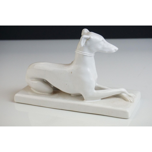 25 - Minton's blanc de chine ceramic  recumbent Greyhound dog marked to underside Mintons England, 18cms ... 