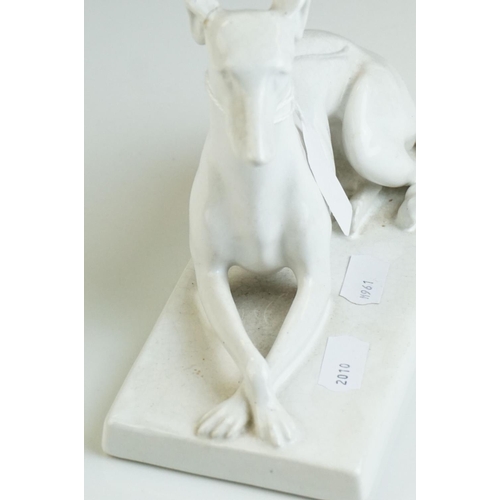 25 - Minton's blanc de chine ceramic  recumbent Greyhound dog marked to underside Mintons England, 18cms ... 