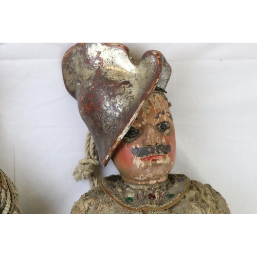 262 - Two large carved wooden dolls with painted faces in 18th century costume believed to be Continental.